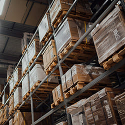 Wrapped pallet goods stored in warehouse racking system
