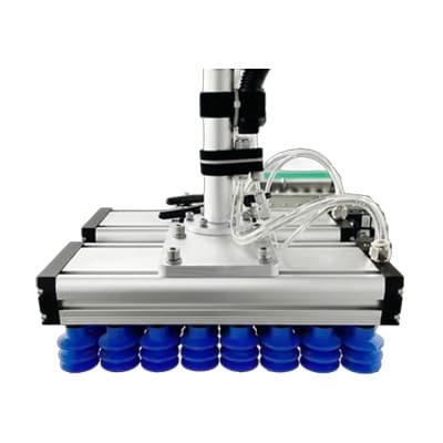 Vacuum gripper end effector with four black suction cups for cobot palletizer carton packaging.