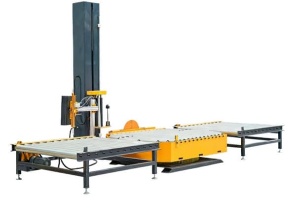Inline pallet wrapping machine on white background for automated conveyor-based pallet packaging.